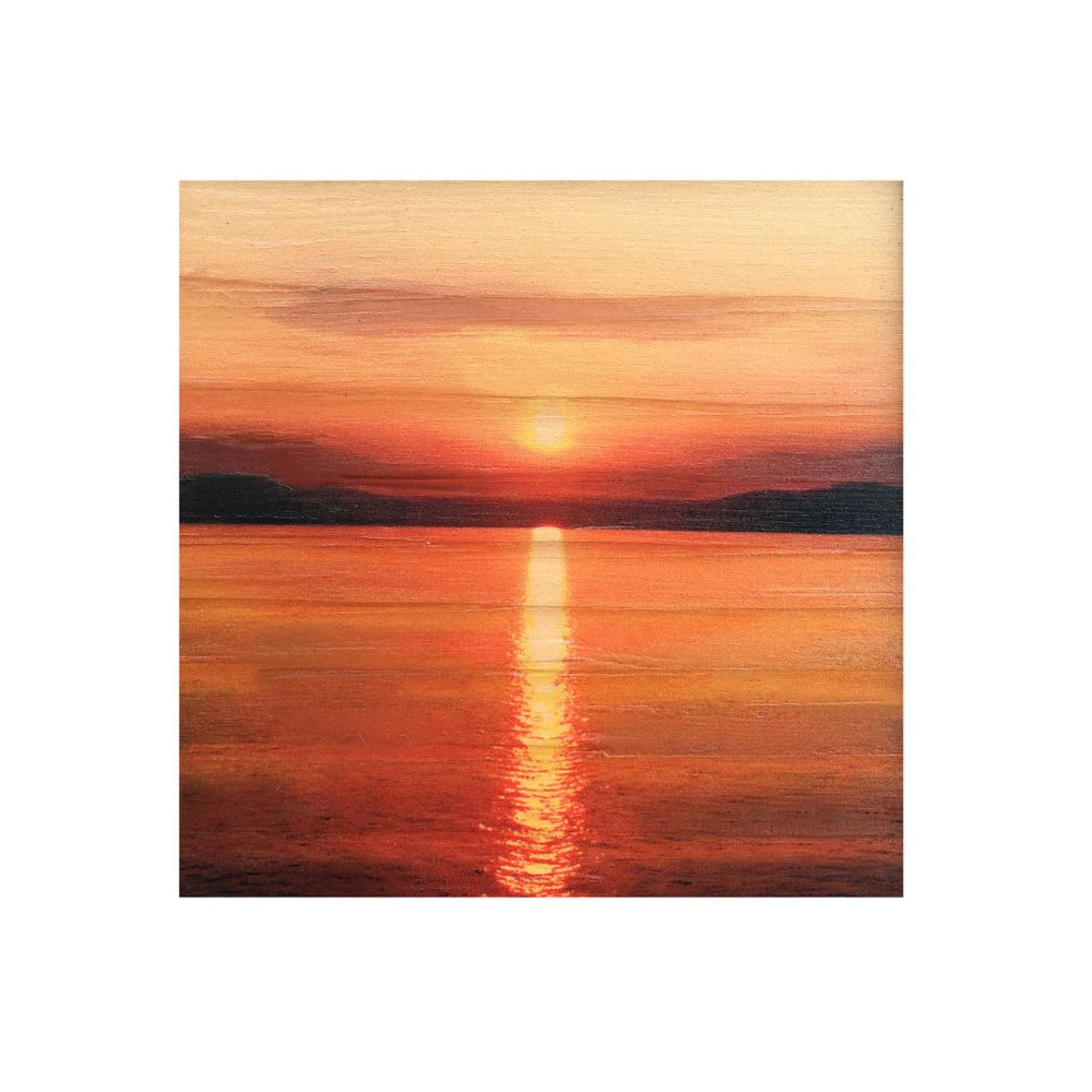 Sunset over a calm body of water with a wooden frame.